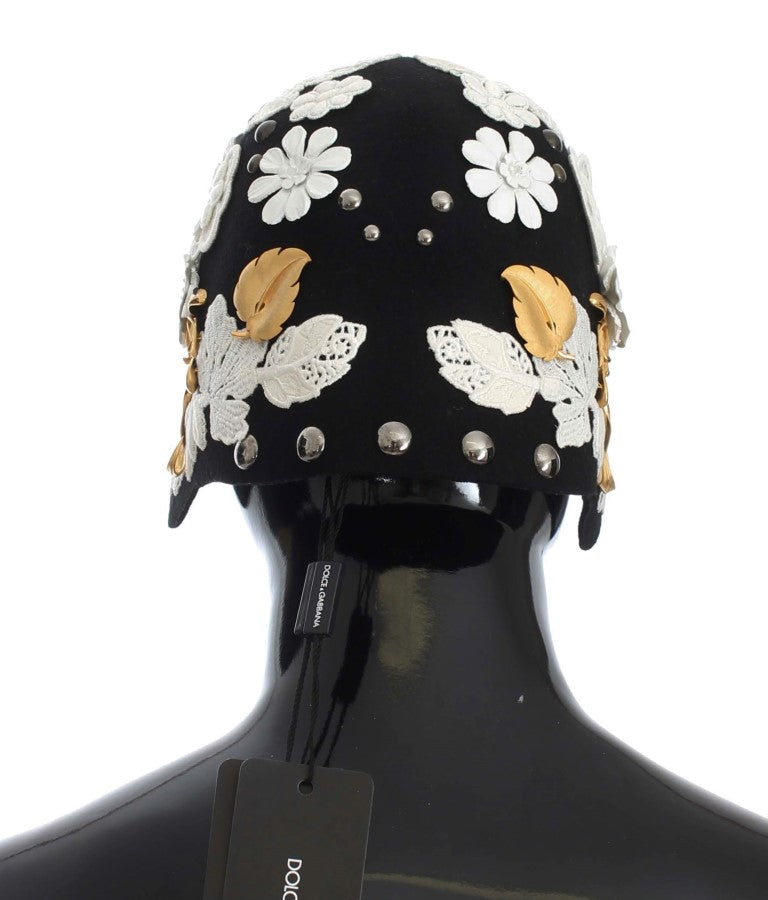 Schwarze Wollmütze mit weißem Blumenmuster und Blattgold
