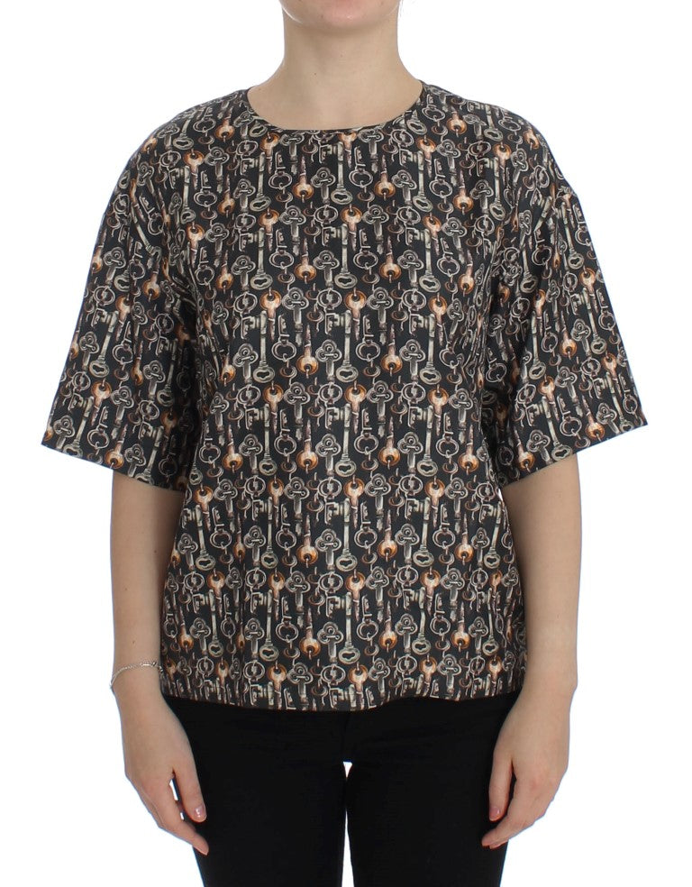 Graues Seidenblusen-T-Shirt mit goldenem Schlüsseldruck