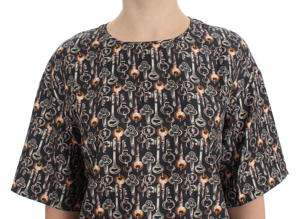 Graues Seidenblusen-T-Shirt mit goldenem Schlüsseldruck