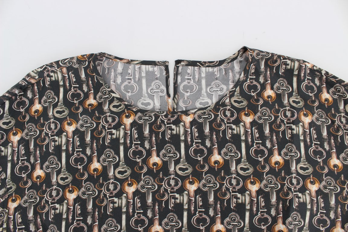 Graues Seidenblusen-T-Shirt mit goldenem Schlüsseldruck
