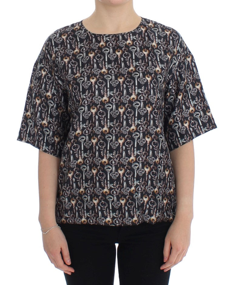 Graues Seidenblusen-T-Shirt mit goldenem Schlüsseldruck