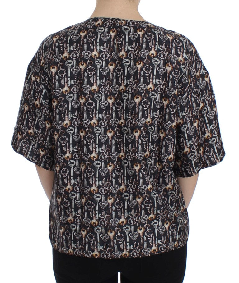 Graues Seidenblusen-T-Shirt mit goldenem Schlüsseldruck