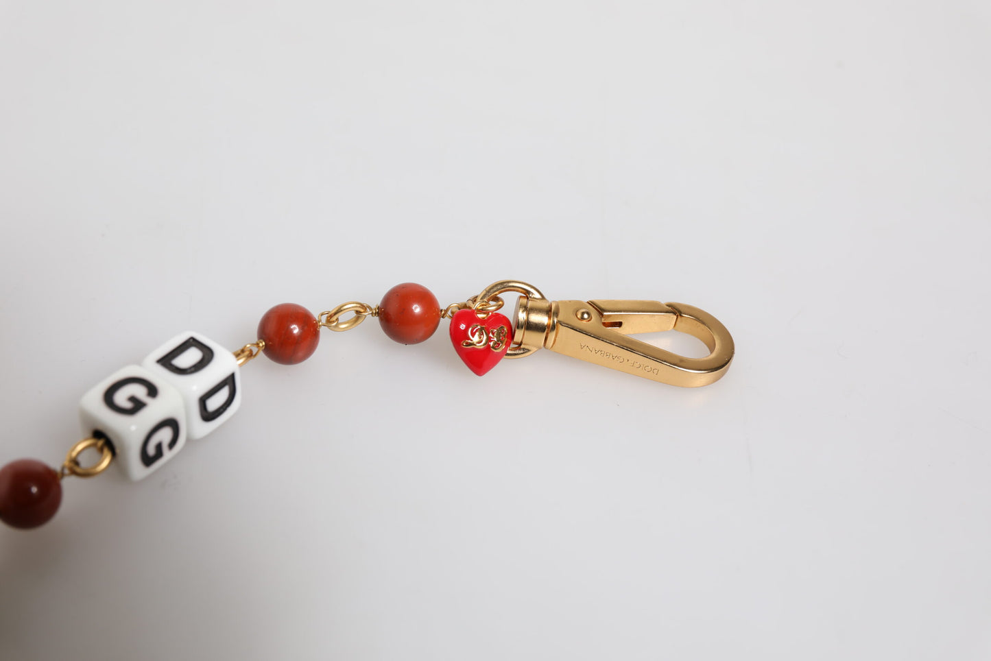 Mehrfarbiges, goldfarbenes Messingkettenarmband mit DG-Logo und Würfeln