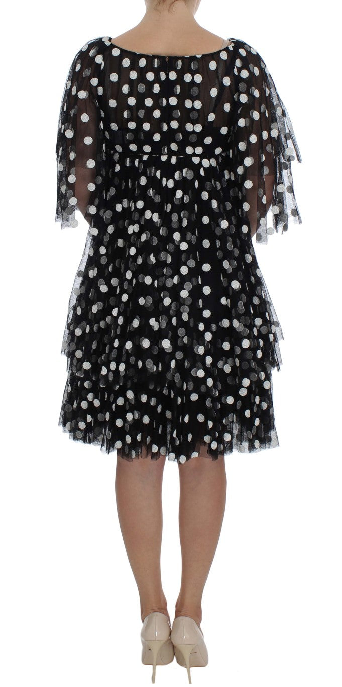 Schwarz-weißes gepunktetes Rüschenkleid