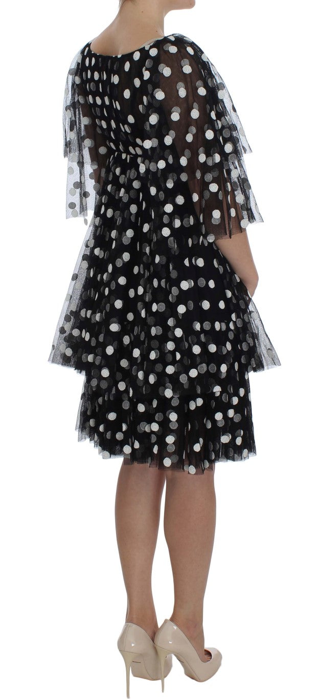 Schwarz-weißes gepunktetes Rüschenkleid