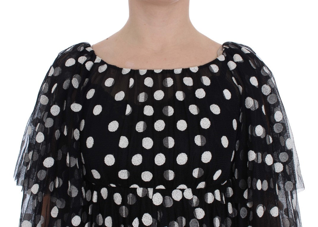 Schwarz-weißes gepunktetes Rüschenkleid