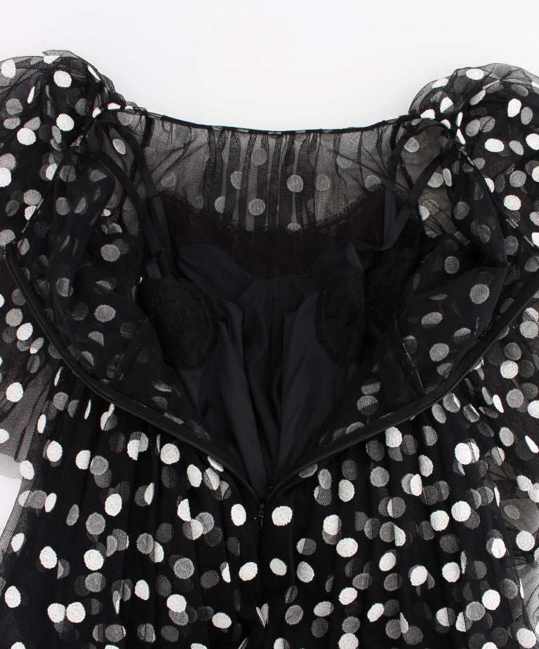 Schwarz-weißes gepunktetes Rüschenkleid