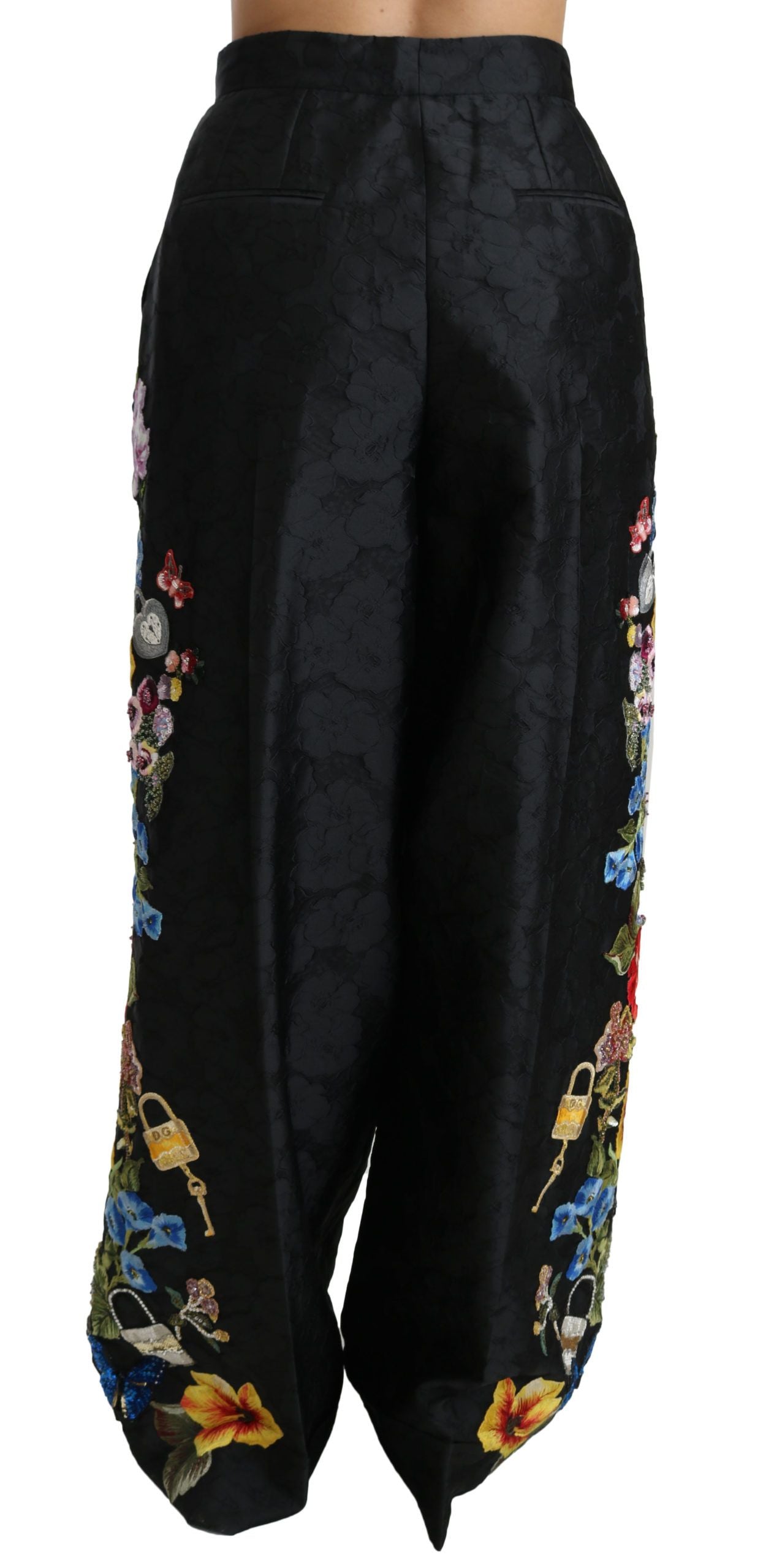 Schwarze Brokathose mit Blumenmuster und Pailletten