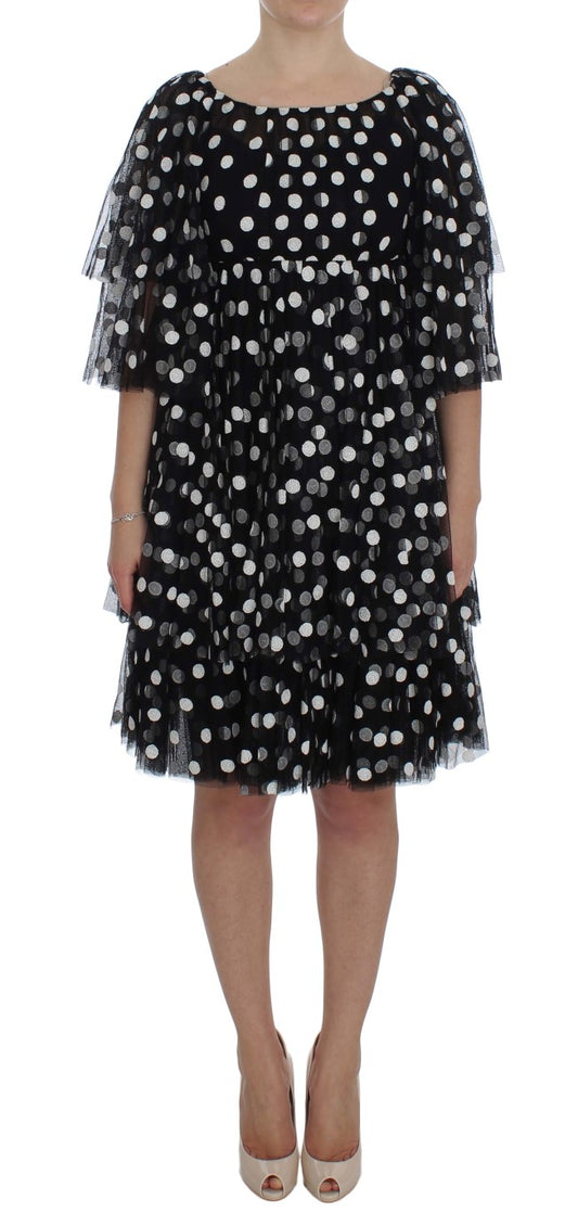 Schwarz-weißes gepunktetes Rüschenkleid