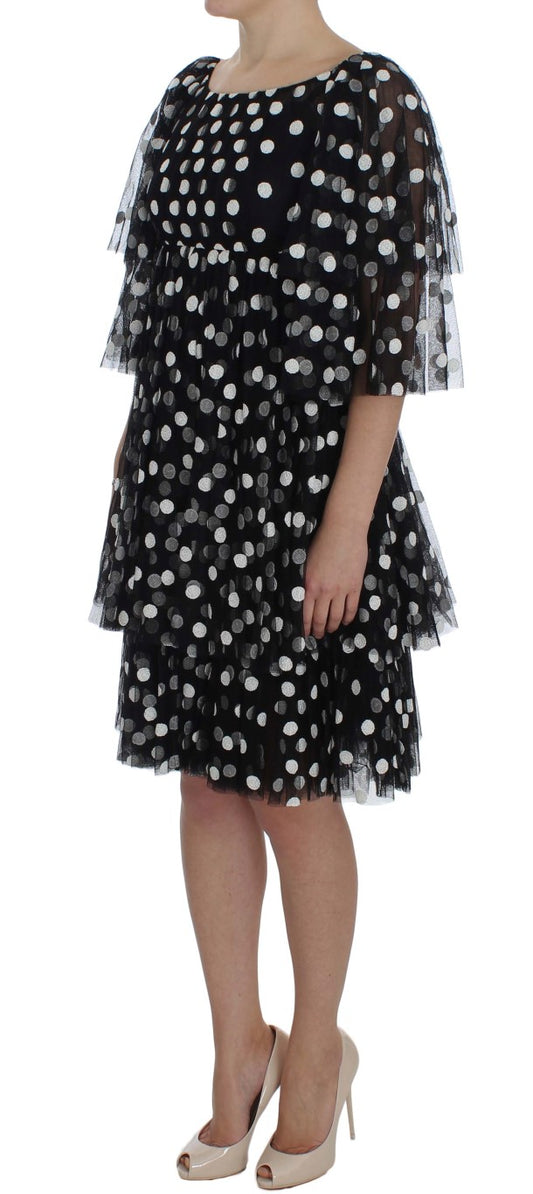 Schwarz-weißes gepunktetes Rüschenkleid