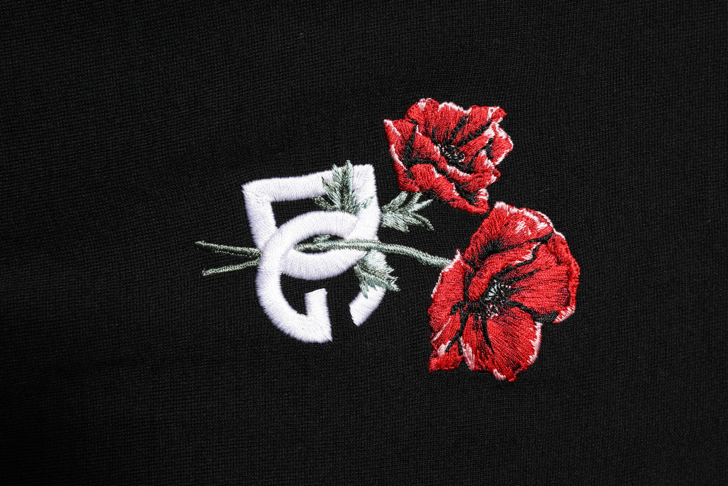 Schwarzes Poloshirt aus Wolle mit DG-Logo und Rosenkragen